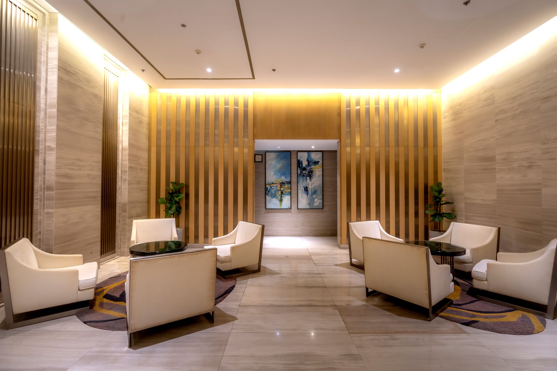 A hotel lounge with warm lighting.