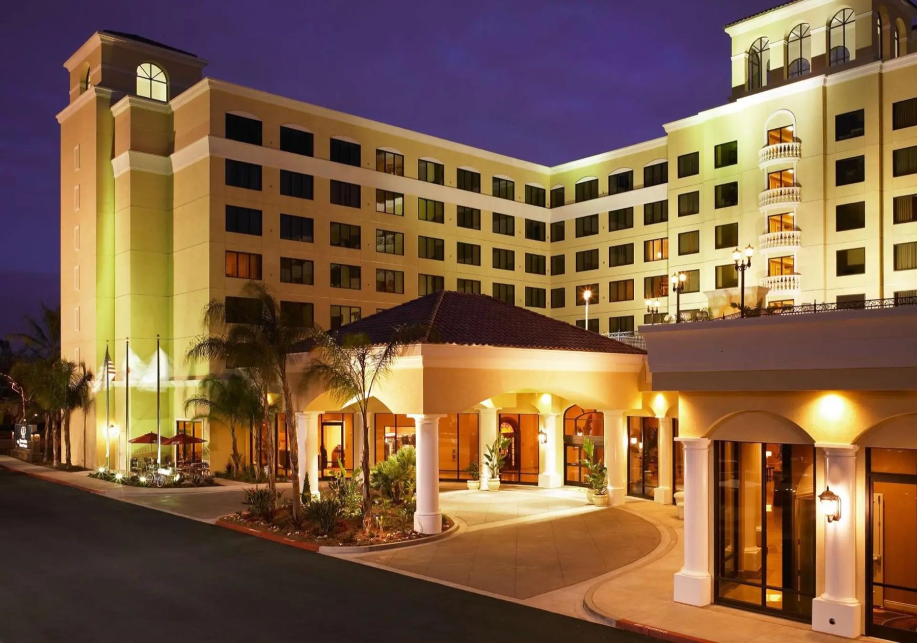 Night exterior of a suite hotel.