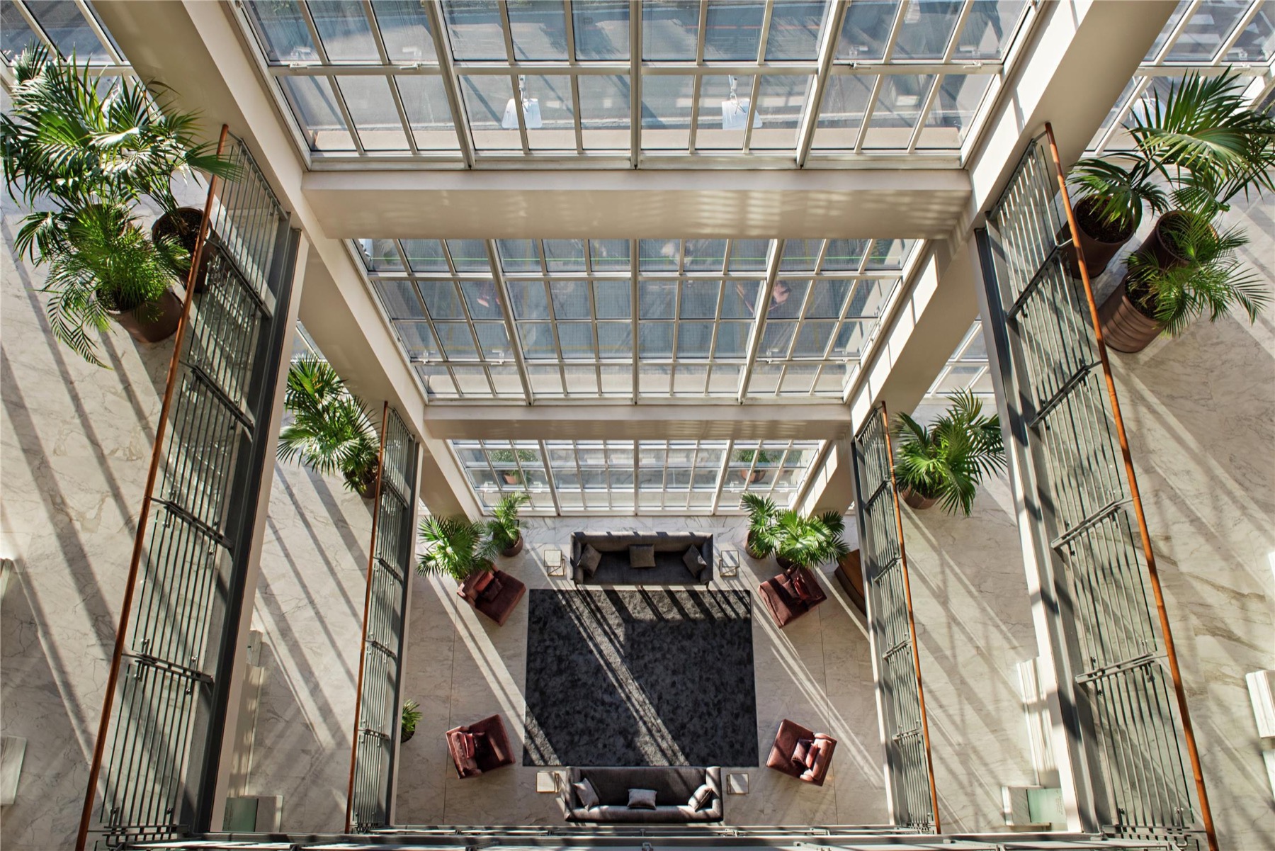 Glass-roofed lobby of the DoubleTree inside Turin’s Lingotto.